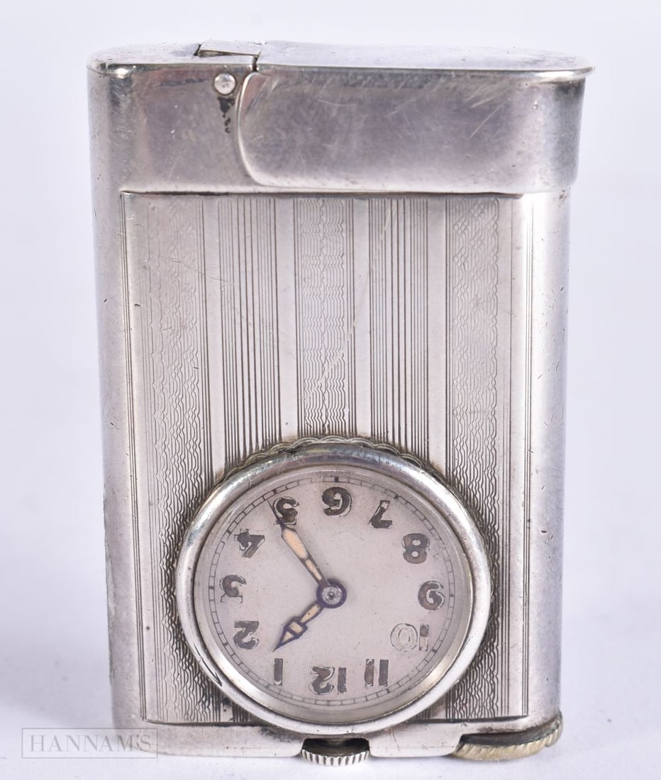 AN ART DECO FRENCH SILVER CLOCK LIGHTER. 5.75 cm high. (1 of 4)