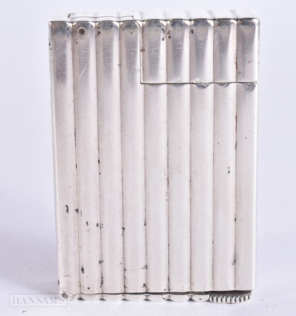 AN ART DECO FRENCH SILVER LIGHTER. 5.25 cm high. (1 of 4)