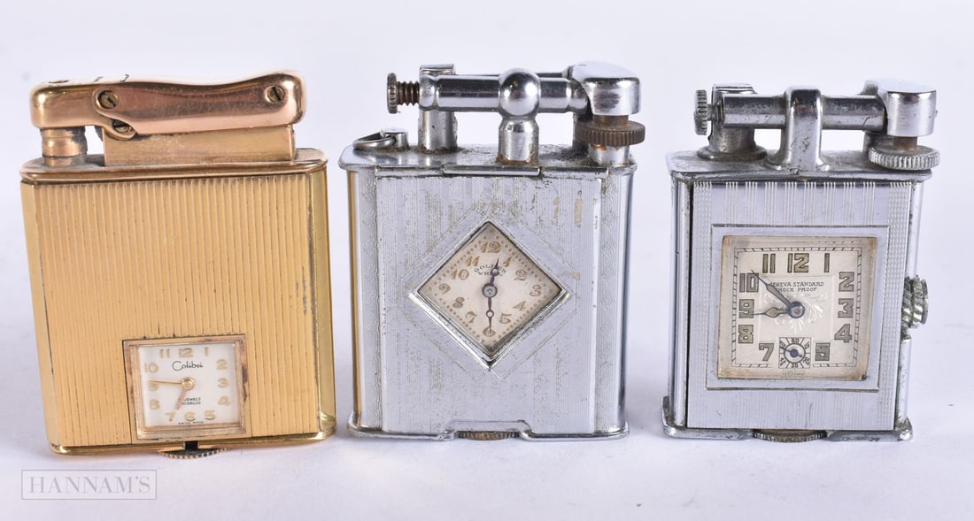 TWO ART DECO AND A 1950S CLOCK WATCH LIGHTER. (3) (1 of 6)