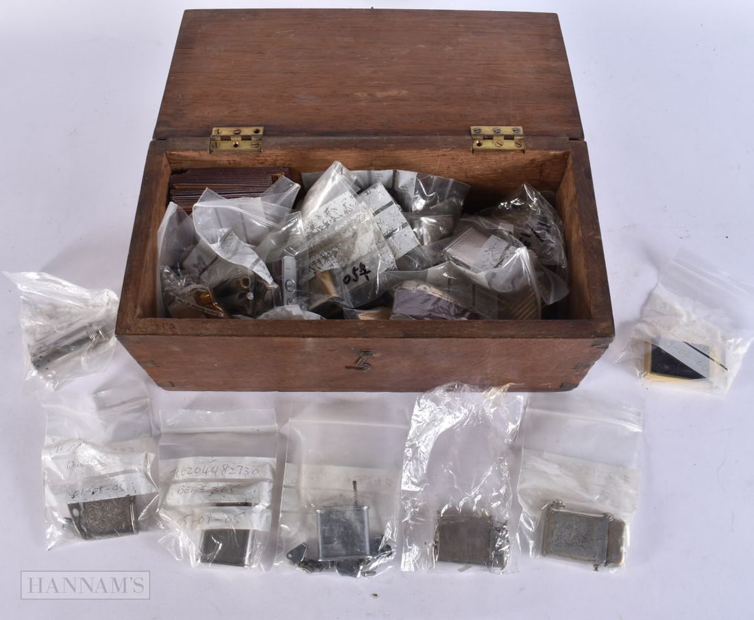 A WOODEN BOX containing lighters and spares etc. (qty) (1 of 10)