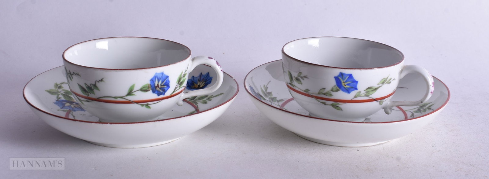 Meissen pair of teacups and saucers painted with a brown line entwined with morning glory, crossed s (1 of 3)