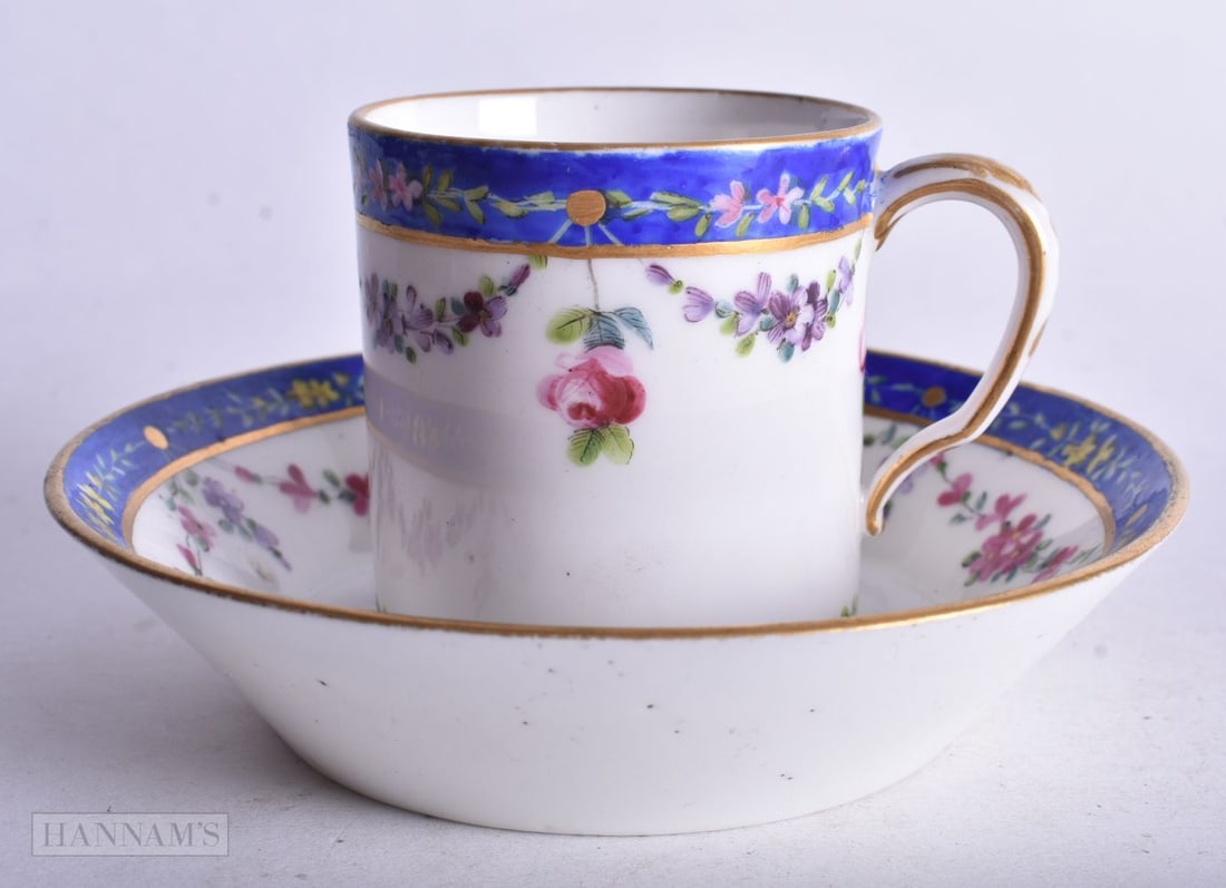 Sevres style coffee can and saucer with blue border and a large C with a halo, mark SB L?s jj, early (1 of 3)