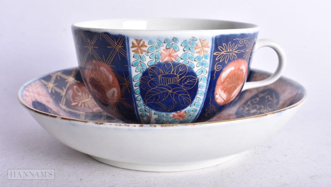 Worcester teacup and saucer painted in imari style with the ?Old Mosaic? pattern, 13 cm diameter: Worcester teacup and saucer painted in imari style with the ?Old Mosaic? pattern, 13 cm diameter