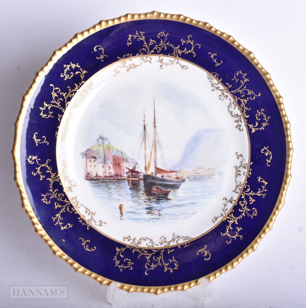 Royal Crown Derby plate painted with a view of The Harbour, Ilfracombe, by WEJ Dean, signed, prov: E: Royal Crown Derby plate painted with a view of The Harbour, Ilfracombe, by WEJ Dean, signed, prov: Edward Knapper Collection, 22.5 cm diameter