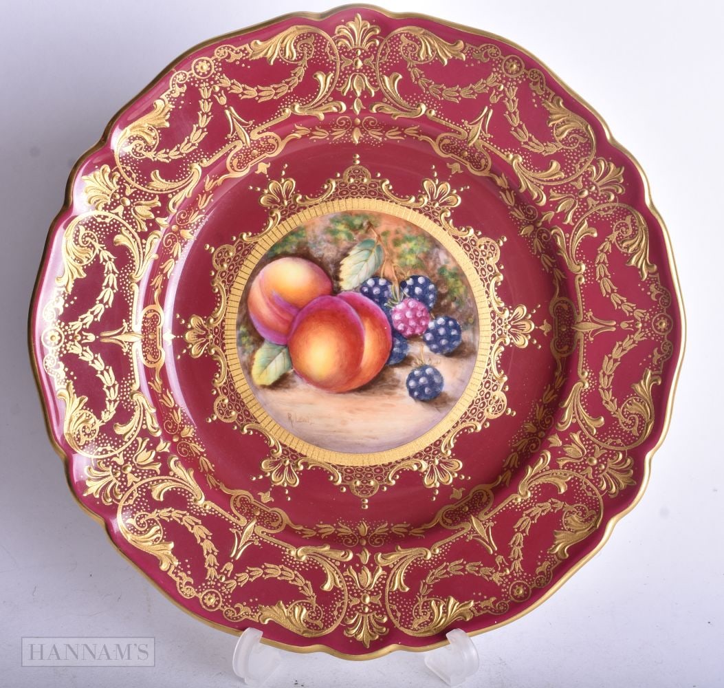 Royal Worcester claret ground plate painted with fruit on a mossy ground, the border with rich raise (1 of 2)