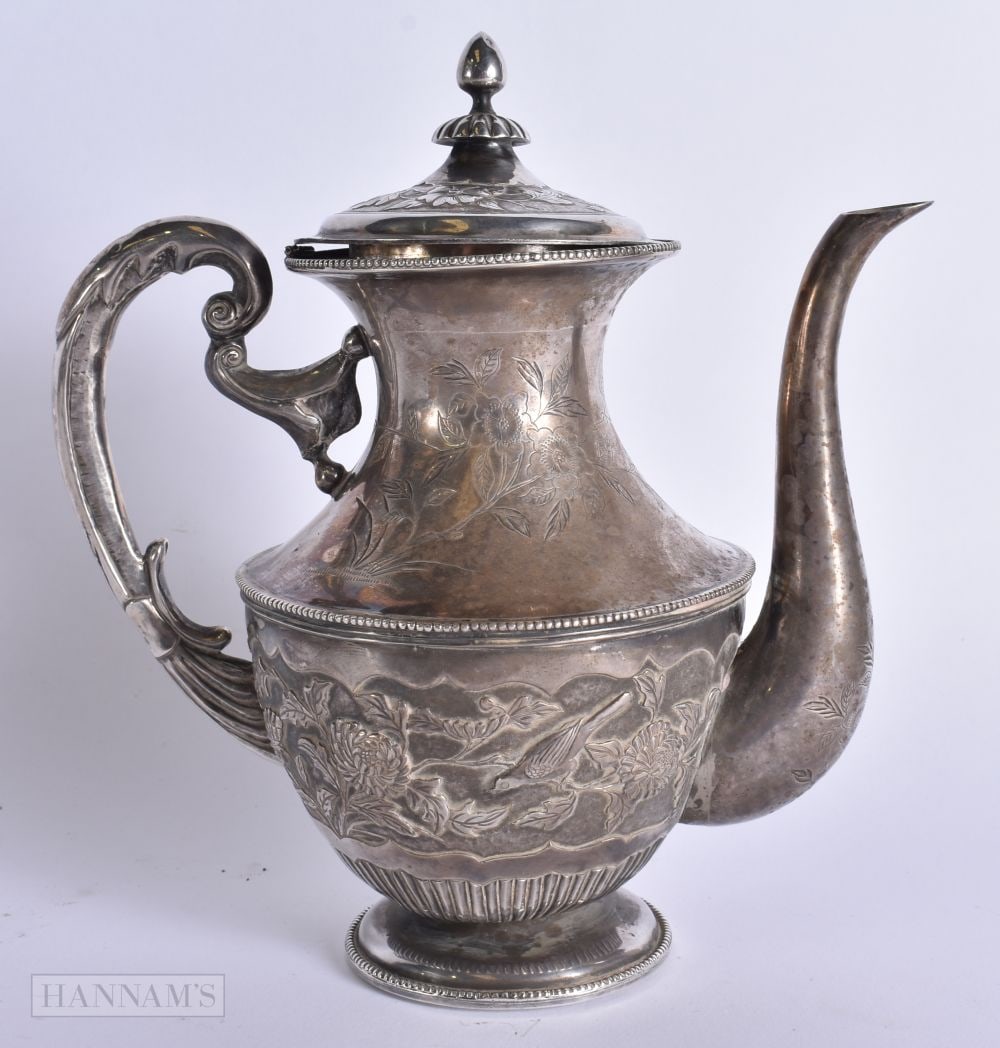 AN ANTIQUE EASTERN WHITE METAL COFFEE POT decorated with birds. 647 grams overall. 22 cm x 16 cm.: AN ANTIQUE EASTERN WHITE METAL COFFEE POT decorated with birds. 647 grams overall. 22 cm x 16 cm.