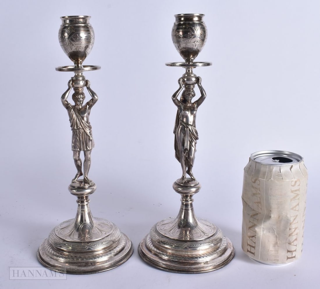 A PAIR OF ANTIQUE CONTINENTAL SILVER FIGURAL CANDLESTICKS. 1050 grams overall. 26.5 cm high. (1 of 6)