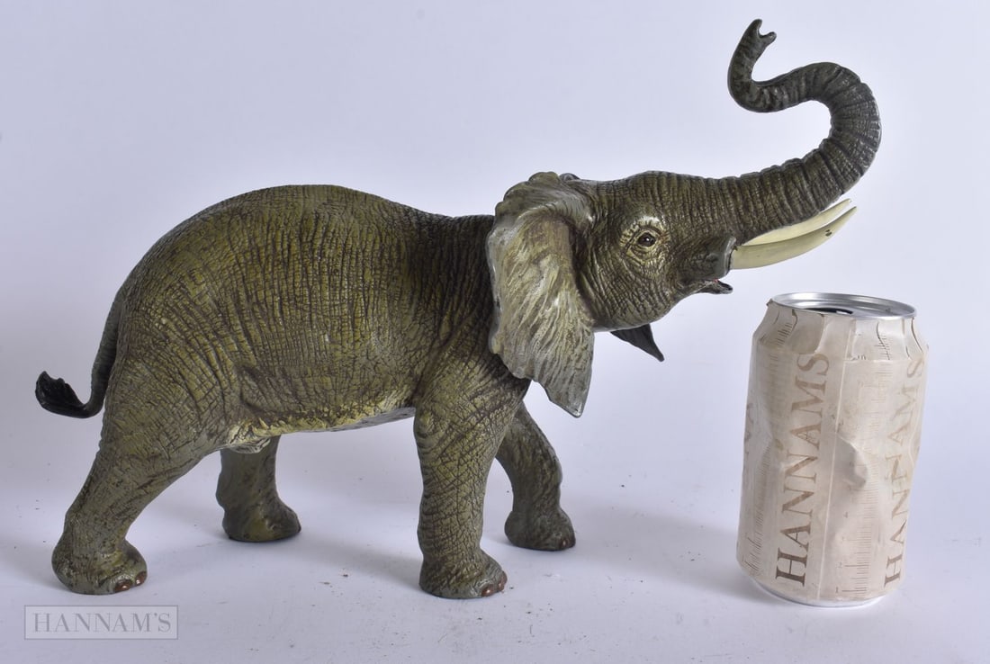 A COLD PAINTED BRONZE ELEPHANT. 34 cm x 22 cm. (1 of 7)