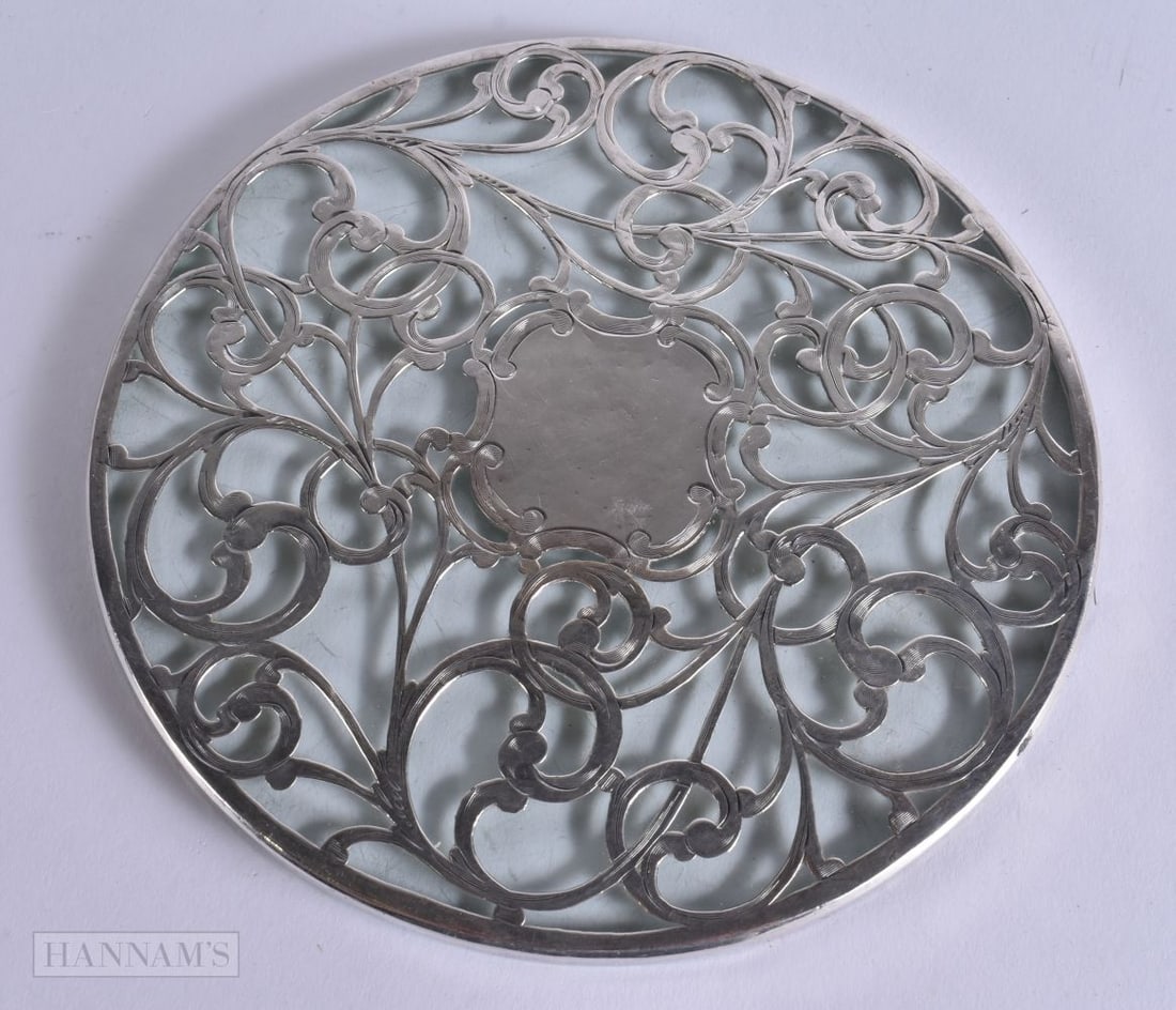 A SILVER OVERLAID GLASS TRIVET STAND. 17 cm wide. (1 of 5)