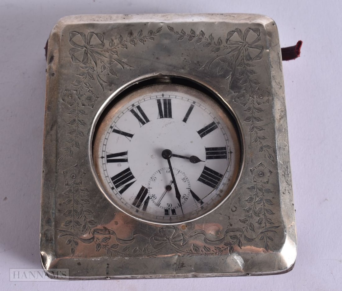 AN ANTIQUE SILVER CASED TRAVELLING CLOCK. Running. 10 cm x 11 cm. (1 of 4)