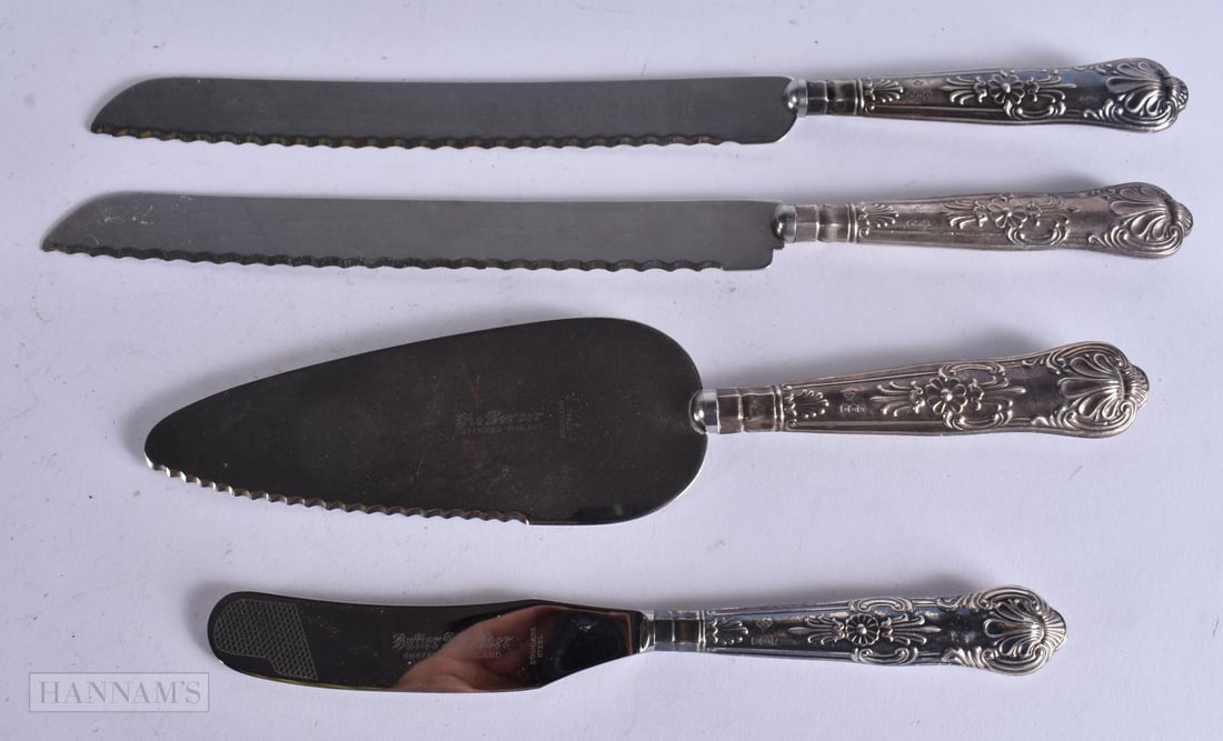 FOUR SILVER HANDLED ITEMS. Largest 28 cm long. (4) (1 of 6)