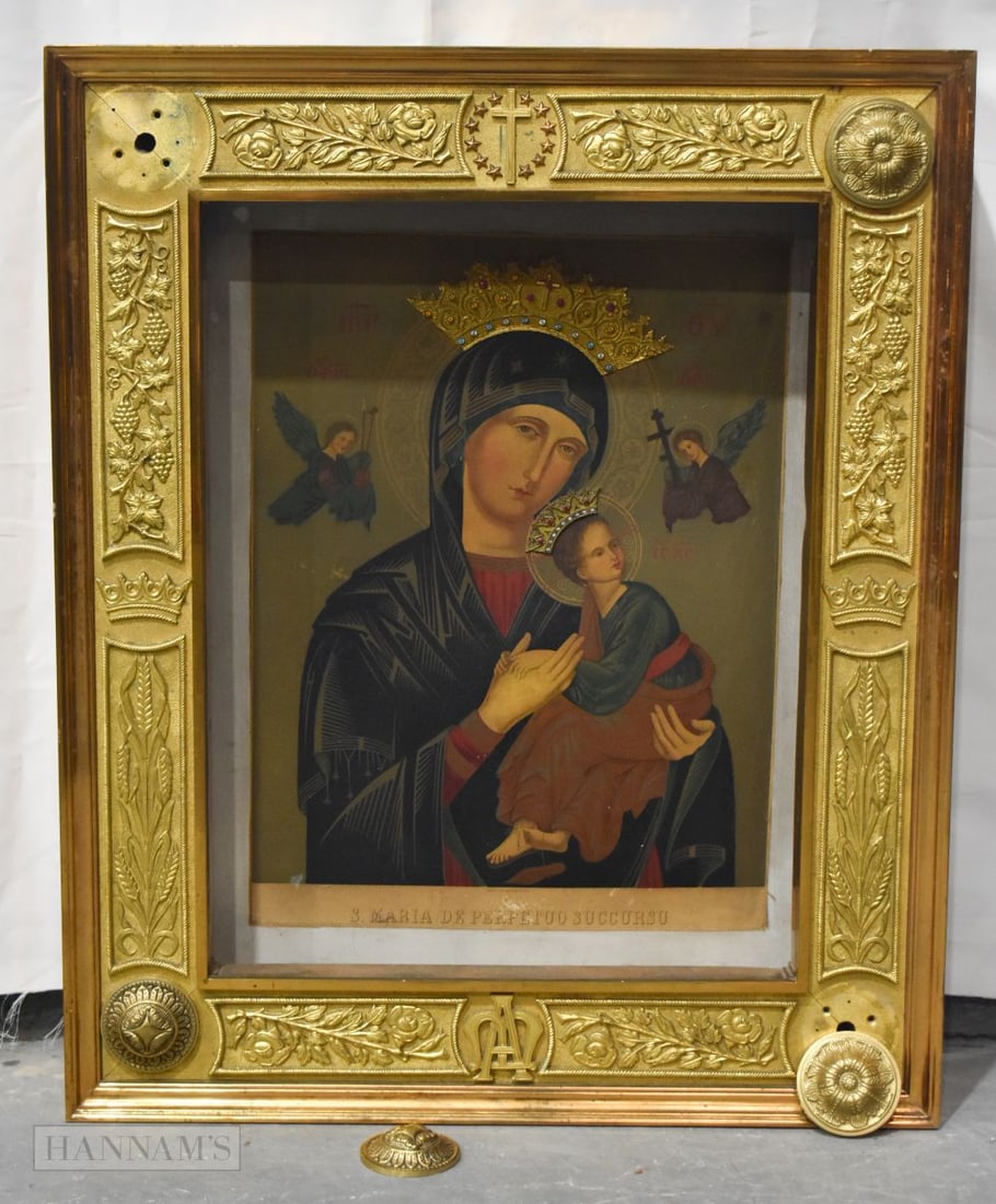 A LARGE RUSSIAN ICON contained within a heavy bronze frame. 85 cm x 68 cm. (1 of 12)