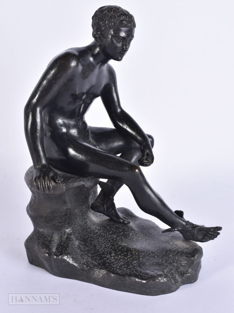 A 19TH CENTURY GRAND TOUR BRONZE FIGURE OF HERMES modelled seated upon a rocky outcrop. 27 cm x 17 c: A 19TH CENTURY GRAND TOUR BRONZE FIGURE OF HERMES modelled seated upon a rocky outcrop. 27 cm x 17 cm.
