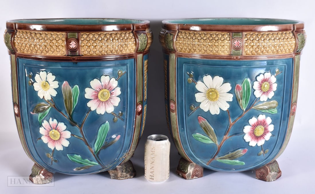 A RARE PAIR OF VICTORIAN WEDGWOOD MAJOLICA PLANTER JARDINIERES decorated in relief with foliage and (1 of 6)