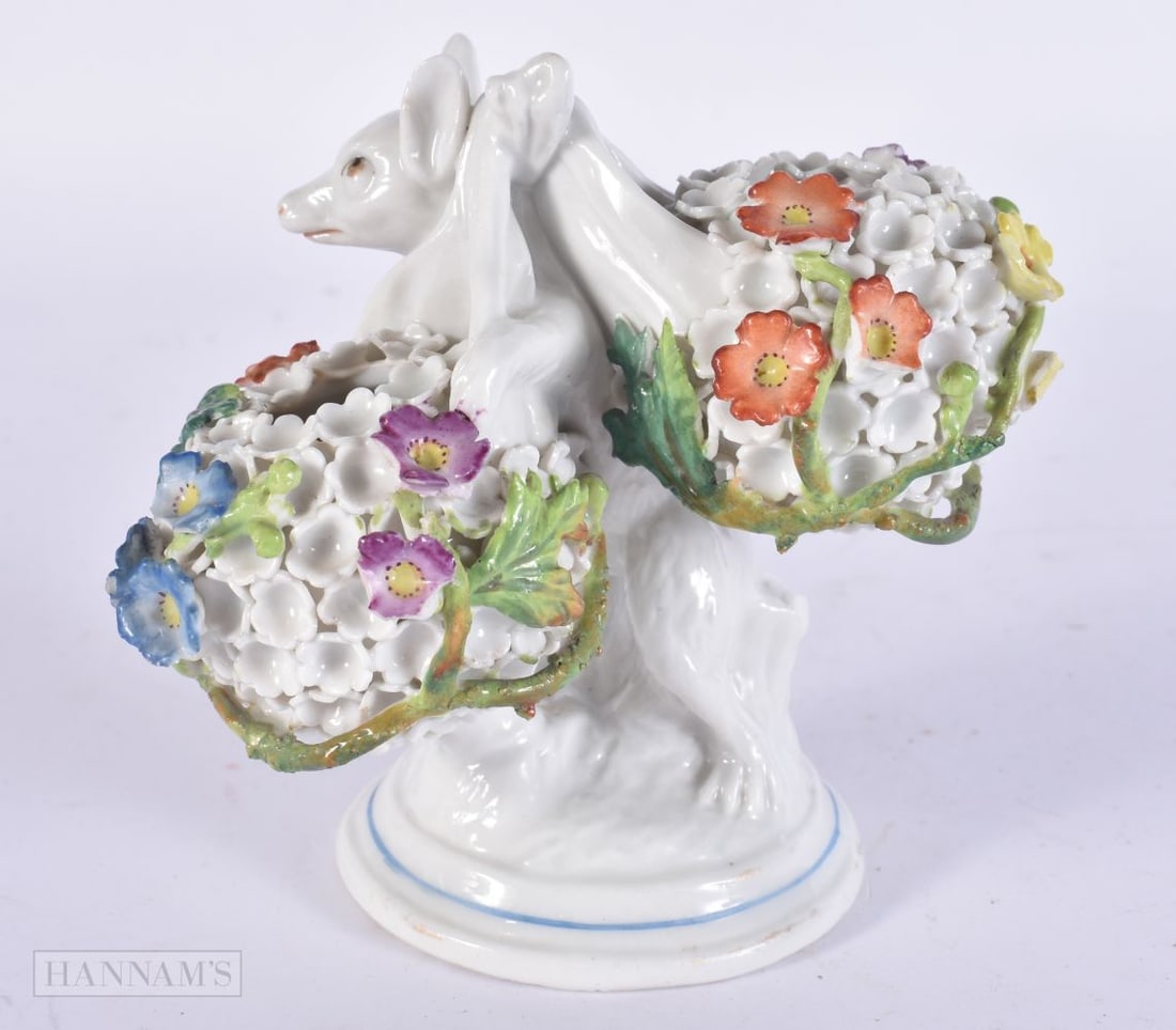 AN UNUSUAL VICTORIAN PORCELAIN FIGURE OF A MOUSE modelled carrying floral encrusted baskets. 10 cm x (1 of 6)