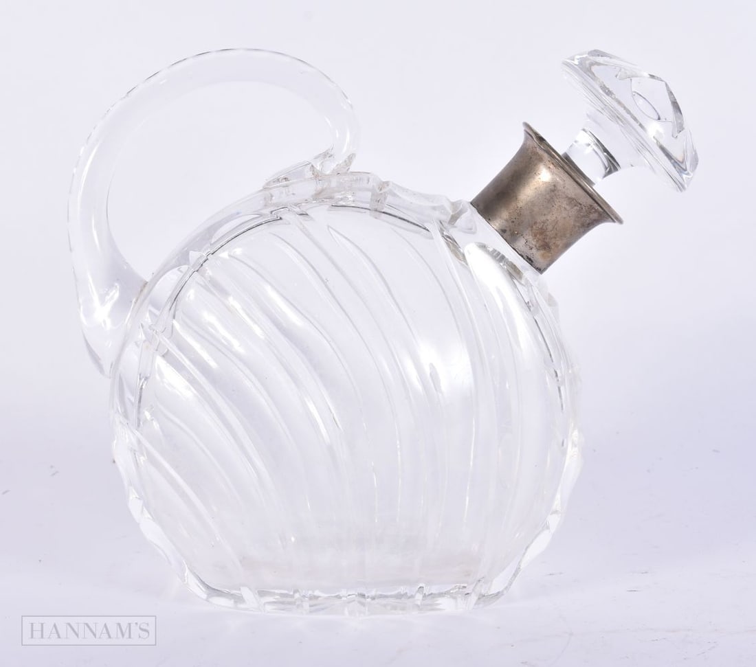 AN ART DECO SILVER MOUNTED GLASS DECANTER AND STOPPER. 17 cm x 17.5 cm.: AN ART DECO SILVER MOUNTED GLASS DECANTER AND STOPPER. 17 cm x 17.5 cm.
