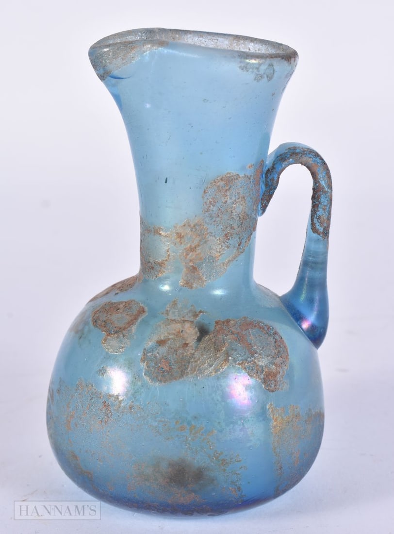 AN ANCIENT ANTIQUITY ROMAN GLASS JUG. 10 cm high. (1 of 5)