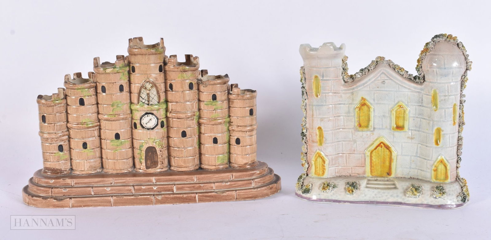 TWO EARLY 19TH CENTURY STAFFORDSHIRE PEARLWARE TURRET GROUPS one modelled with a clock face. Largest (1 of 6)