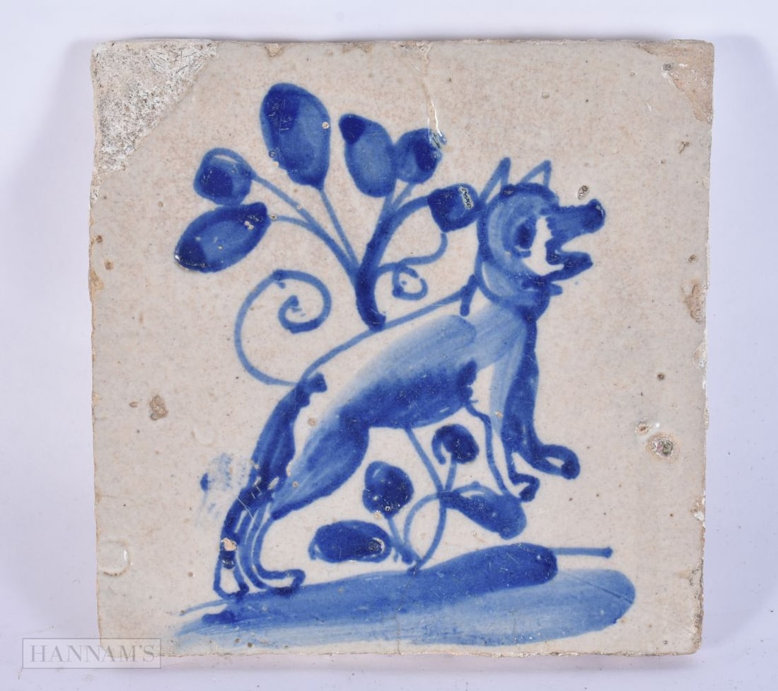 AN EARLY DELFT BLUE AND WHITE POTTERY TILE painted with a leaping hound. 14.5 cm square. (1 of 4)
