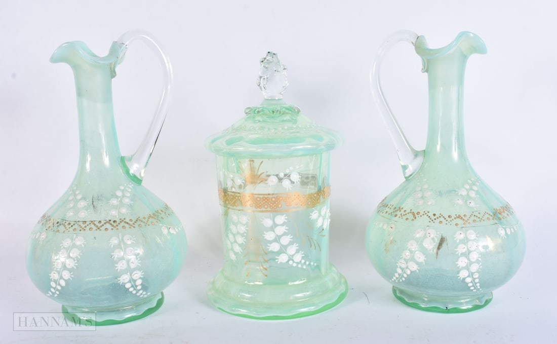 A PAIR OF VICTORIAN OPALINE GLASS JUGS together with a matching jar and cover. Largest 23.5 cm high.: A PAIR OF VICTORIAN OPALINE GLASS JUGS together with a matching jar and cover. Largest 23.5 cm high.