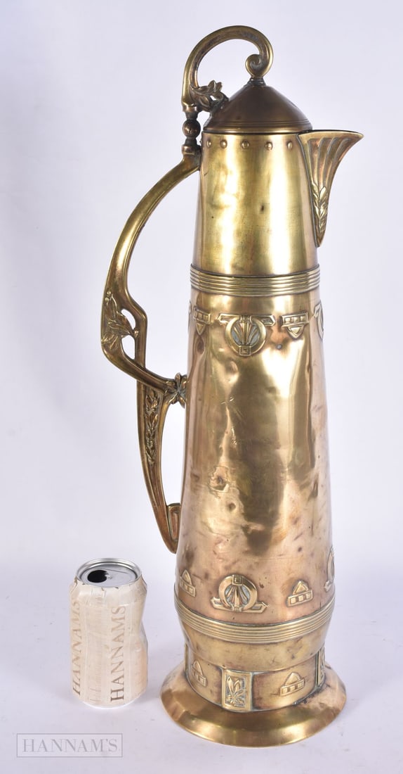 A LARGE SECESSIONIST MOVEMENT BRASS EWER of monumental proportions. 54 cm high.: A LARGE SECESSIONIST MOVEMENT BRASS EWER of monumental proportions. 54 cm high.