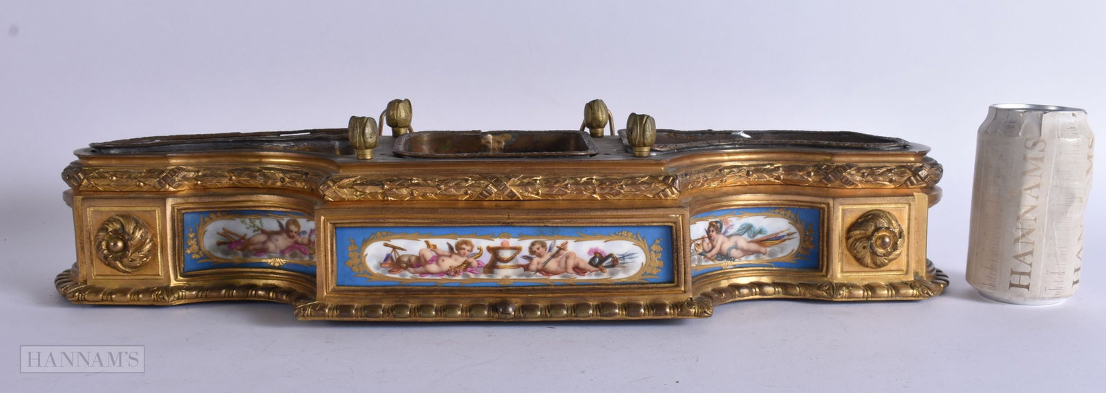A LARGE 19TH CENTURY FRENCH BRONZE AND SEVRES PORCELAIN PLANTER painted with putti and flowers. 52 c: A LARGE 19TH CENTURY FRENCH BRONZE AND SEVRES PORCELAIN PLANTER painted with putti and flowers. 52 cm x 20 cm.