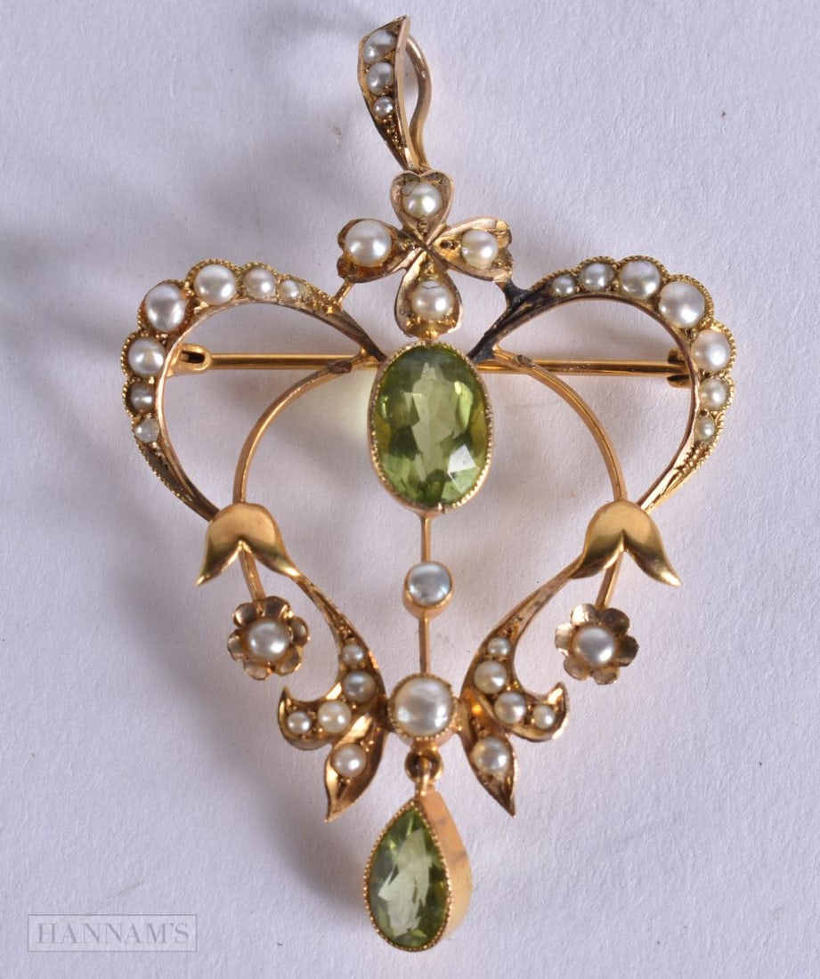 A VICTORIAN 15CT GOLD AND PERIDOT PEARL PENDANT. 4.4 grams. 5 cm x 3.25 cm.: A VICTORIAN 15CT GOLD AND PERIDOT PEARL PENDANT. 4.4 grams. 5 cm x 3.25 cm.