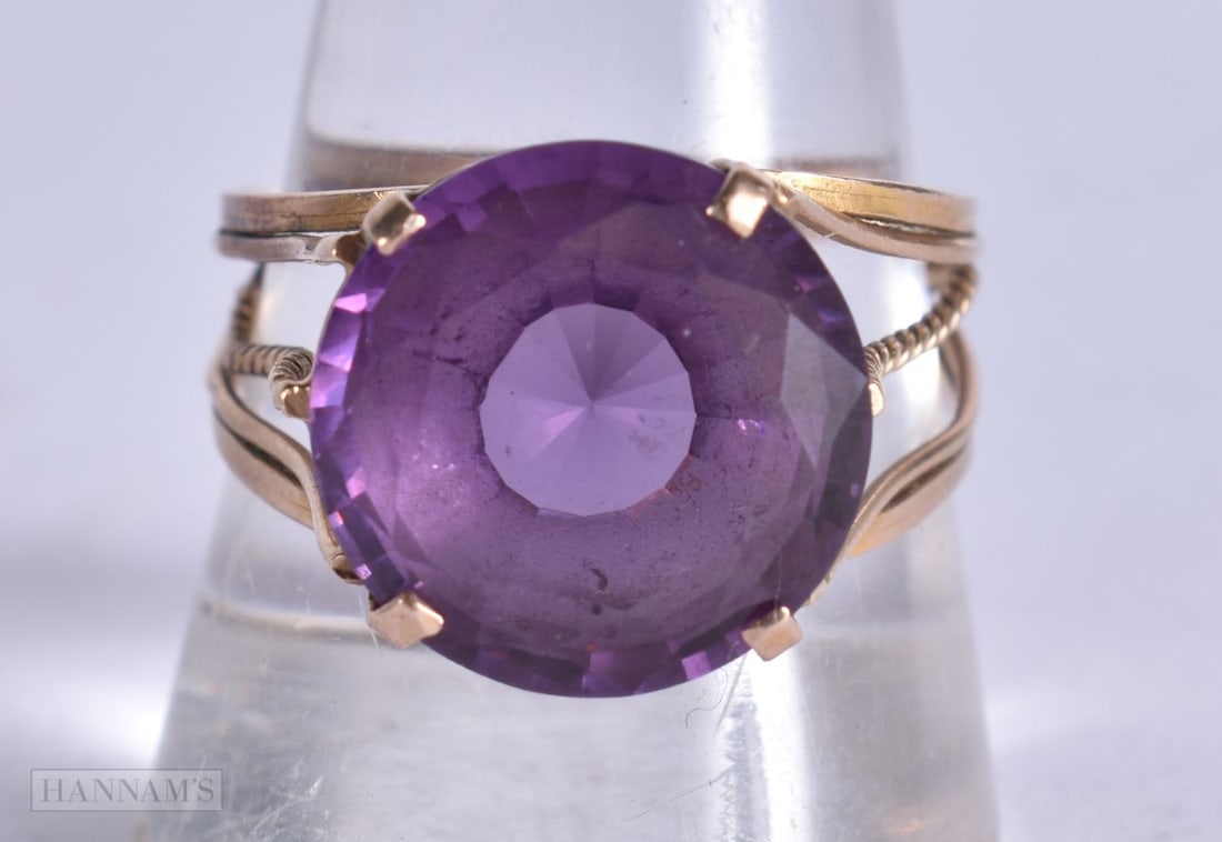 A 9CT GOLD AMETHYST RING. 4.5 grams. T. (1 of 4)