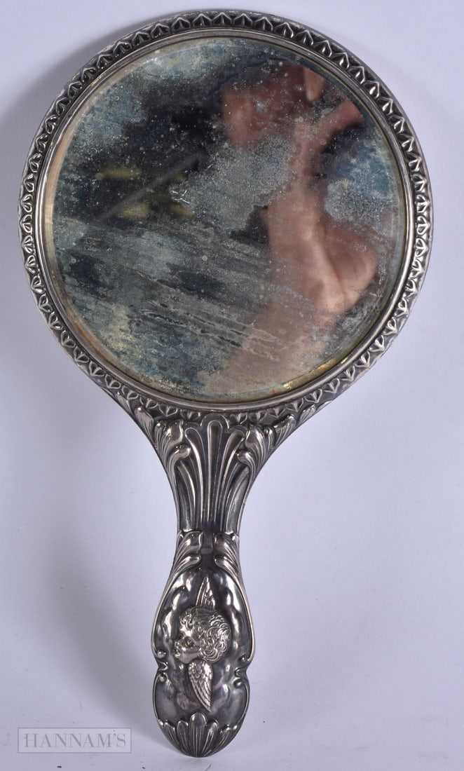 AN ANTIQUE SILVER CHERUB MIRROR. 456 grams overall. 28 cm x 15 cm. (1 of 4)