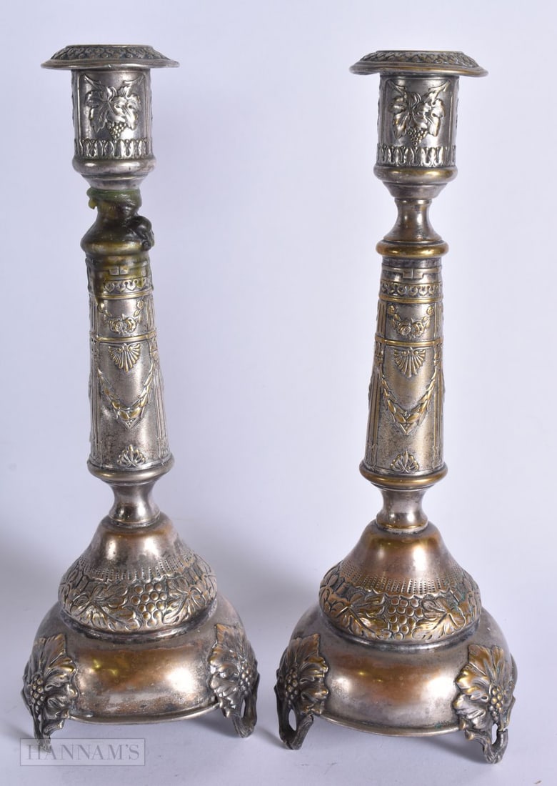A PAIR OF POLISH PLATED CANDLESTICKS. 30 cm high.: A PAIR OF POLISH PLATED CANDLESTICKS. 30 cm high.