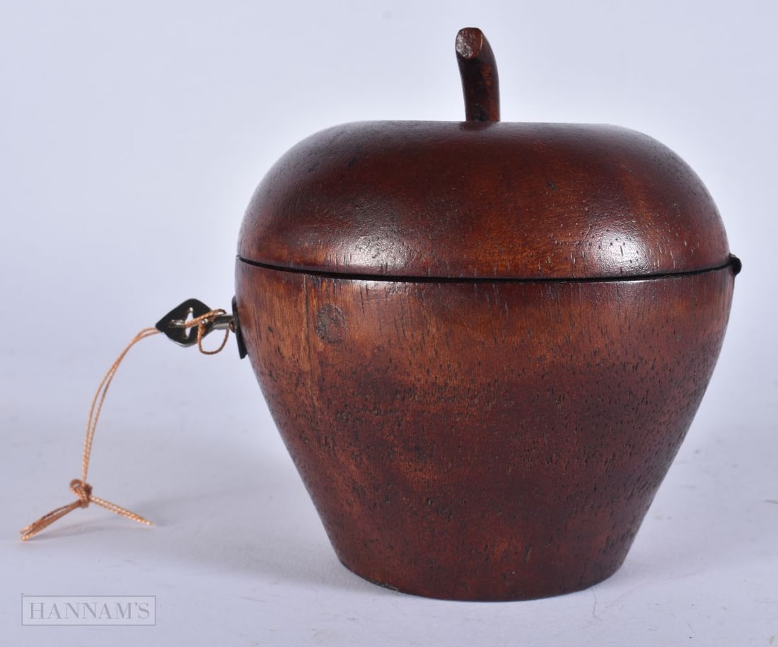 A TREEN FRUIT TEA CADDY. 12.5 cm high. (1 of 3)