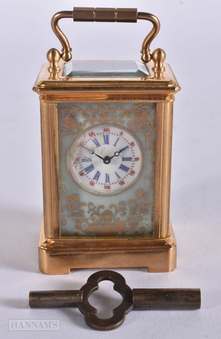 A MINIATURE PORCELAIN INSET CARRIAGE CLOCK. Working. 10 cm high inc handle. (1 of 4)
