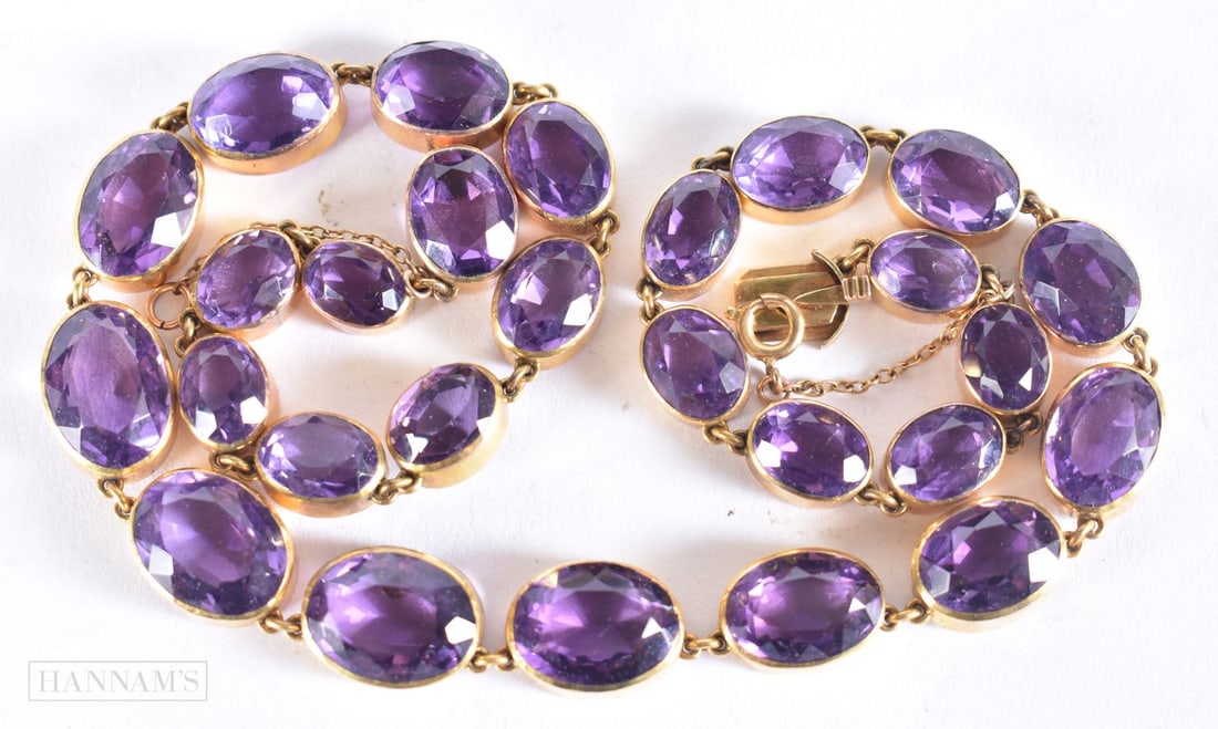 AN ANTIQUE YELLOW METAL AND AMETHYST RIVIERE NECKLACE. 46.7 grams. 42 cm long.: AN ANTIQUE YELLOW METAL AND AMETHYST RIVIERE NECKLACE. 46.7 grams. 42 cm long.