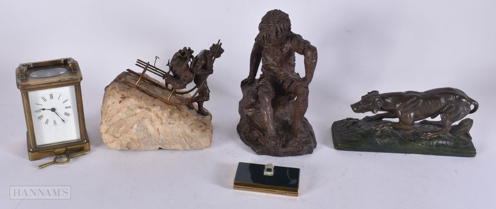 A FRENCH BRASS CARRIAGE CLOCK together with an unusual bronze study of a mountain climber etc. (qty) (1 of 3)