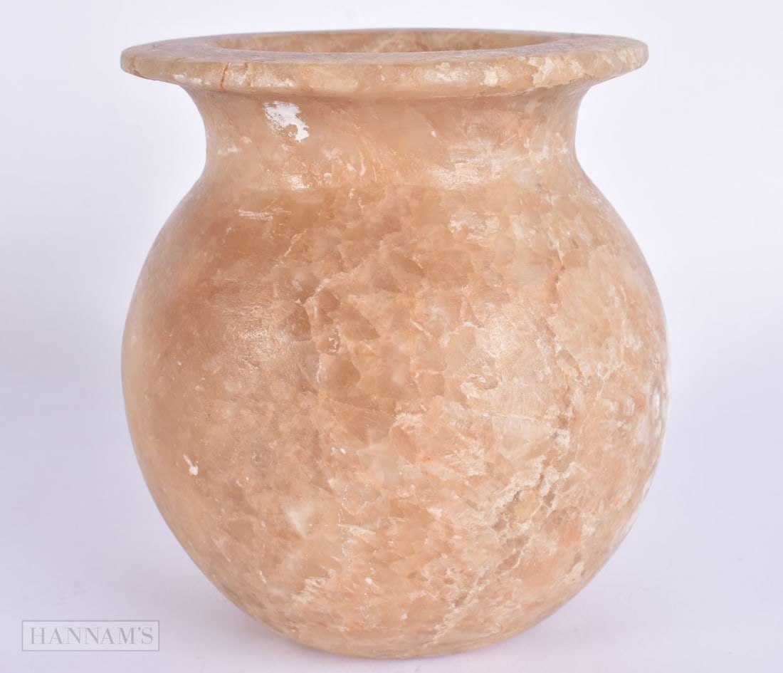 AN EARLY ANTIQUITY EGYPTIAN CARVED ALABASTER JAR. 14 cm x 8 cm. (1 of 4)