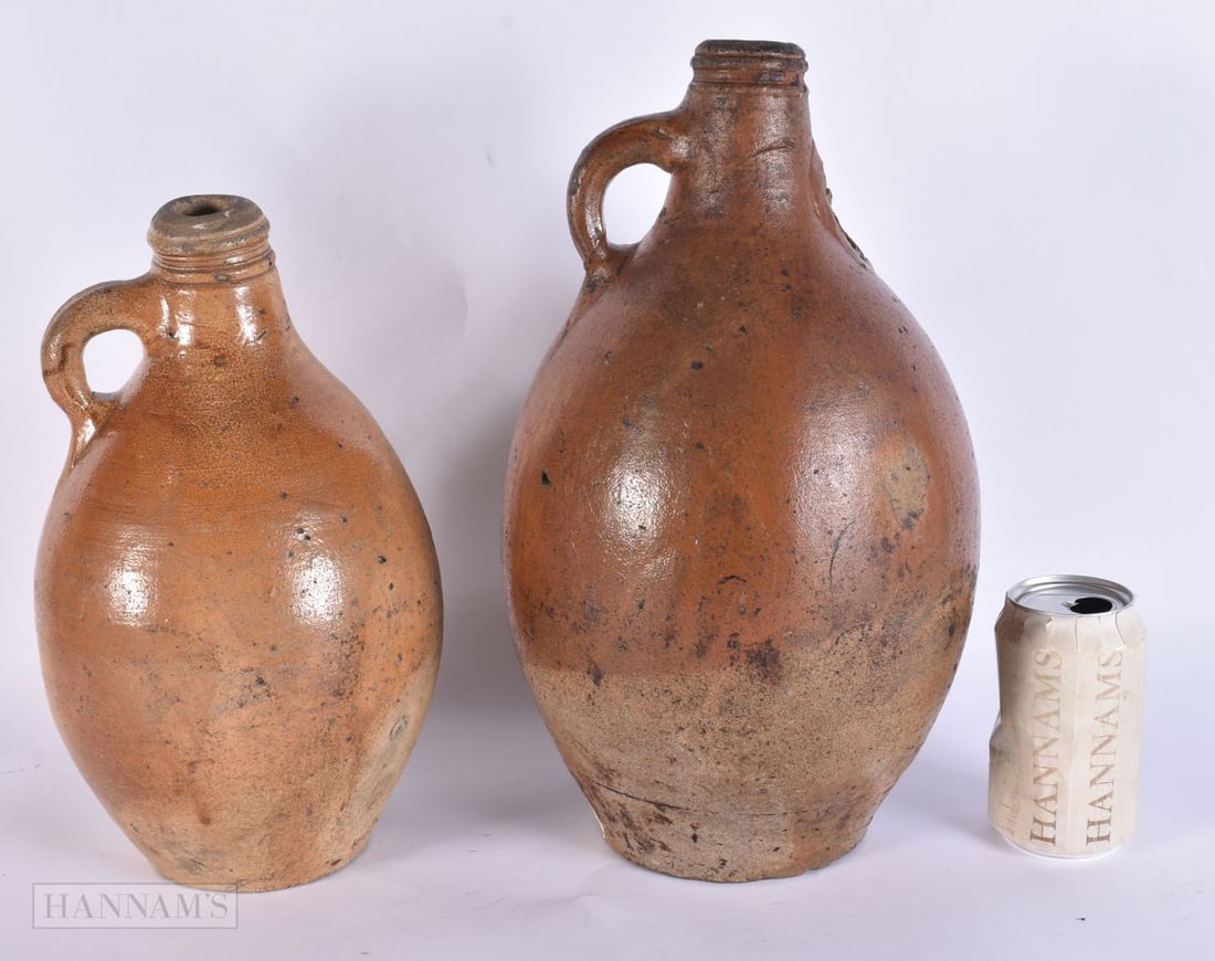 AN 18TH CENTURY STONEWARE BELLARMINE JUG together another similar. 35 cm high. (2) (1 of 5)