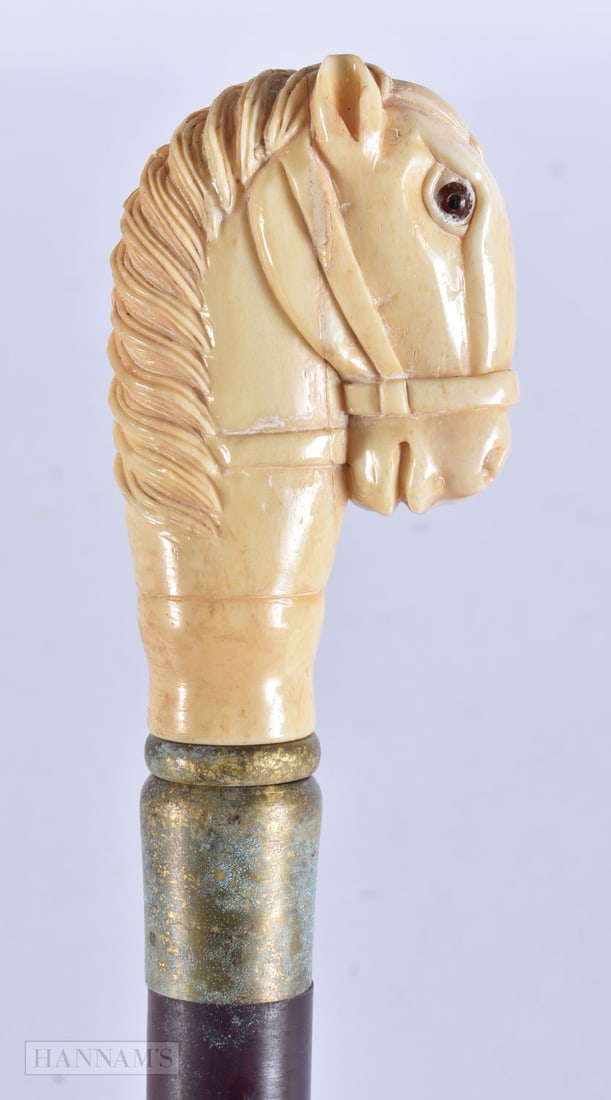 A CARVED BONE WALKING CANE. 90 cm long.: A CARVED BONE WALKING CANE. 90 cm long.