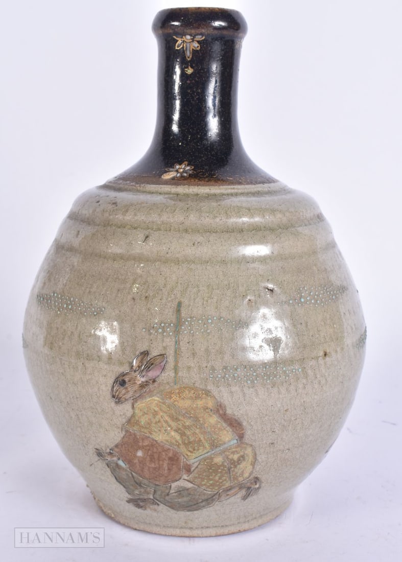 AN EARLY 20TH CENTURY JAPANESE MEIJI PERIOD SAKE BOTTLE decorated with animals. 21.5 cm high.: AN EARLY 20TH CENTURY JAPANESE MEIJI PERIOD SAKE BOTTLE decorated with animals. 21.5 cm high.