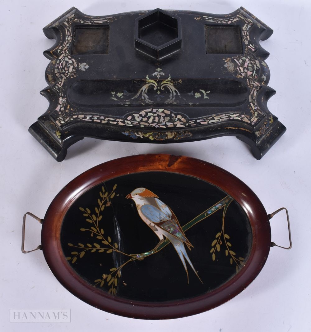 AN ORIENTAL TWIN HANDLED REVERSE PAINTED GLASS TRAY together with a Victorian lacquer desk stand. La: AN ORIENTAL TWIN HANDLED REVERSE PAINTED GLASS TRAY together with a Victorian lacquer desk stand. Largest 32 cm wide. (2)