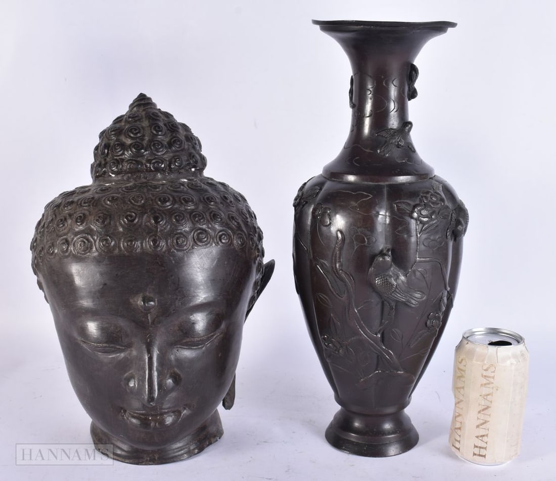AN ANTIQUE JAPANESE BRONZE VASE and a bronze buddha head. Largest 38 cm high. (2): AN ANTIQUE JAPANESE BRONZE VASE and a bronze buddha head. Largest 38 cm high. (2)