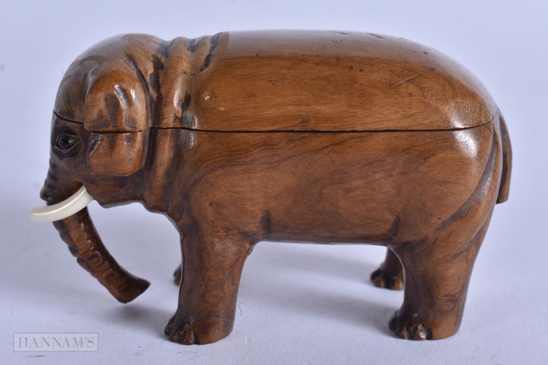 AN EARLY 19TH CENTURY TREEN CARVED WOOD ELEPHANT SNUFF BOX. 9 cm x 5.5 cm.: AN EARLY 19TH CENTURY TREEN CARVED WOOD ELEPHANT SNUFF BOX. 9 cm x 5.5 cm.