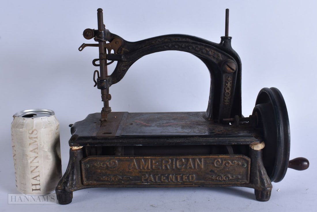 AN ANTIQUE AMERICAN PATENTED CAST IRON SEWING MACHINE. 34 cm x 25 cm. (1 of 6)