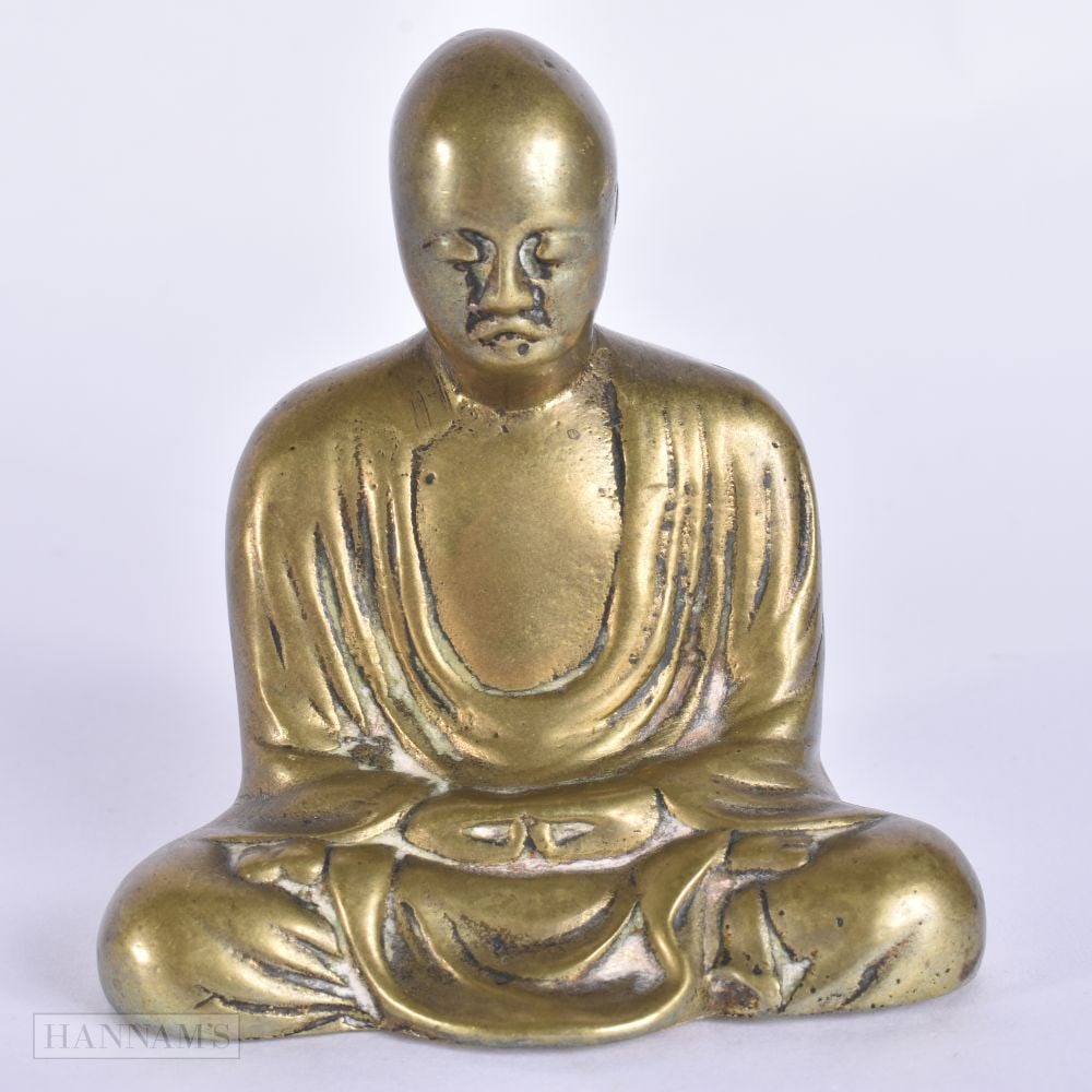 A 19TH CENTURY JAPANESE MEIJI PERIOD BRONZE BUDDHA modelled with hands clasped. 8 cm x 6.5 cm.: A 19TH CENTURY JAPANESE MEIJI PERIOD BRONZE BUDDHA modelled with hands clasped. 8 cm x 6.5 cm.