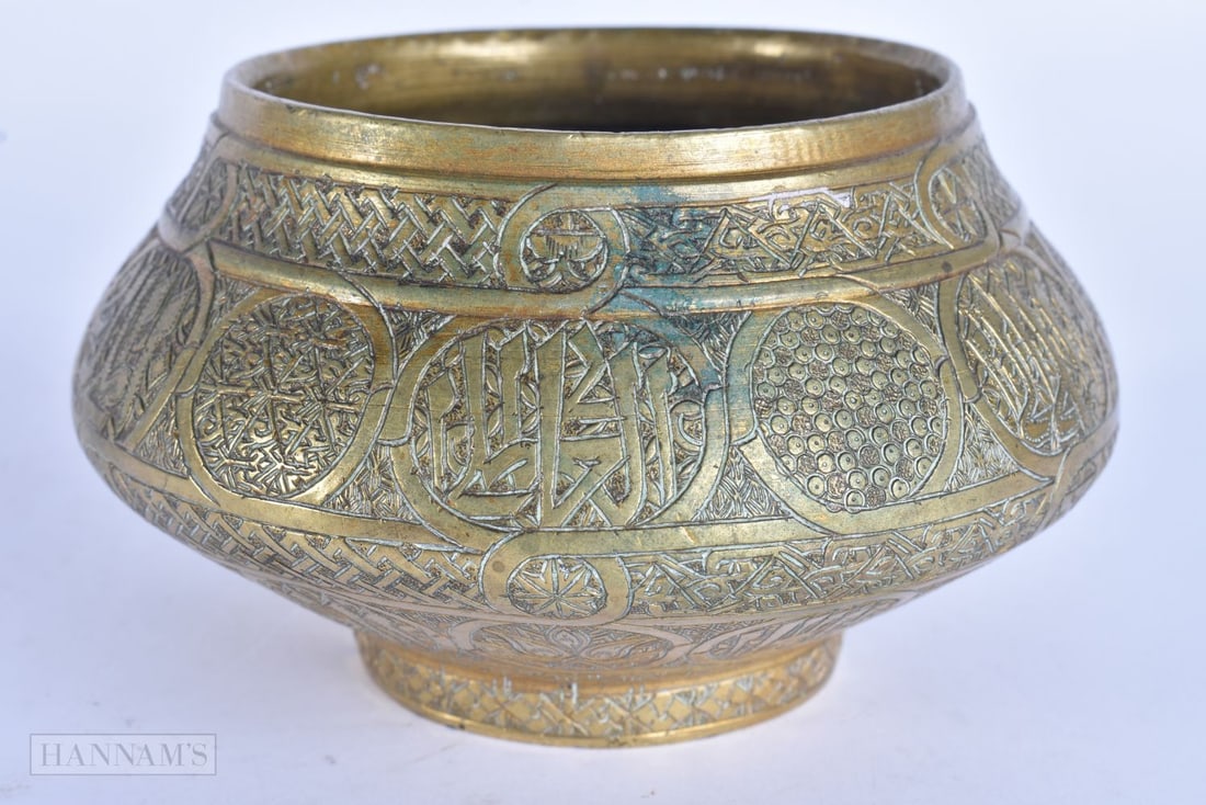 A 19TH CENTURY MIDDLE EASTERN ISLAMIC BRONZE CENSER decorated with Kufic scripture. 12.5 cm wide. (1 of 5)