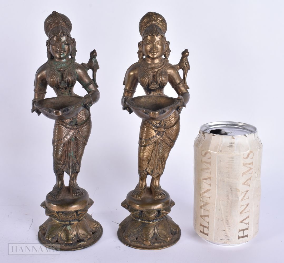 A PAIR OF 19TH CENTURY INDIAN BRONZE HINDU DEITIES modelled holding lipped vessels. 23.5 cm high. (1 of 6)