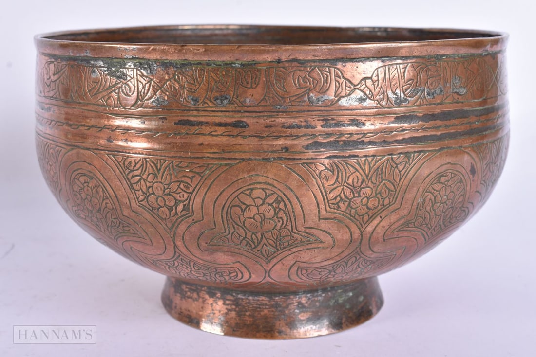 AN 18TH/19TH CENTURY ISLAMIC MIDDLE EASTERN BOWL engraved with motifs. 18 cm wide. (1 of 5)