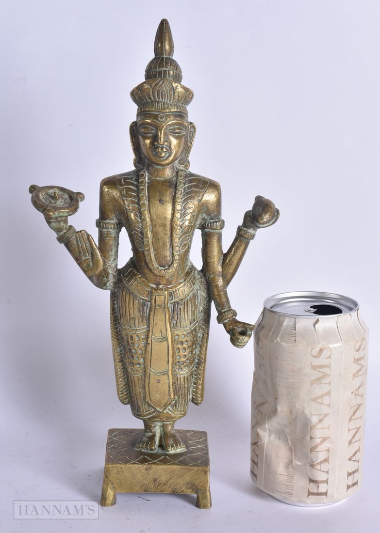 A 19TH CENTURY INDIAN BRONZE FIGURE OF A HINDU DEITY modelled upon a square form base. 28 cm high. (1 of 7)