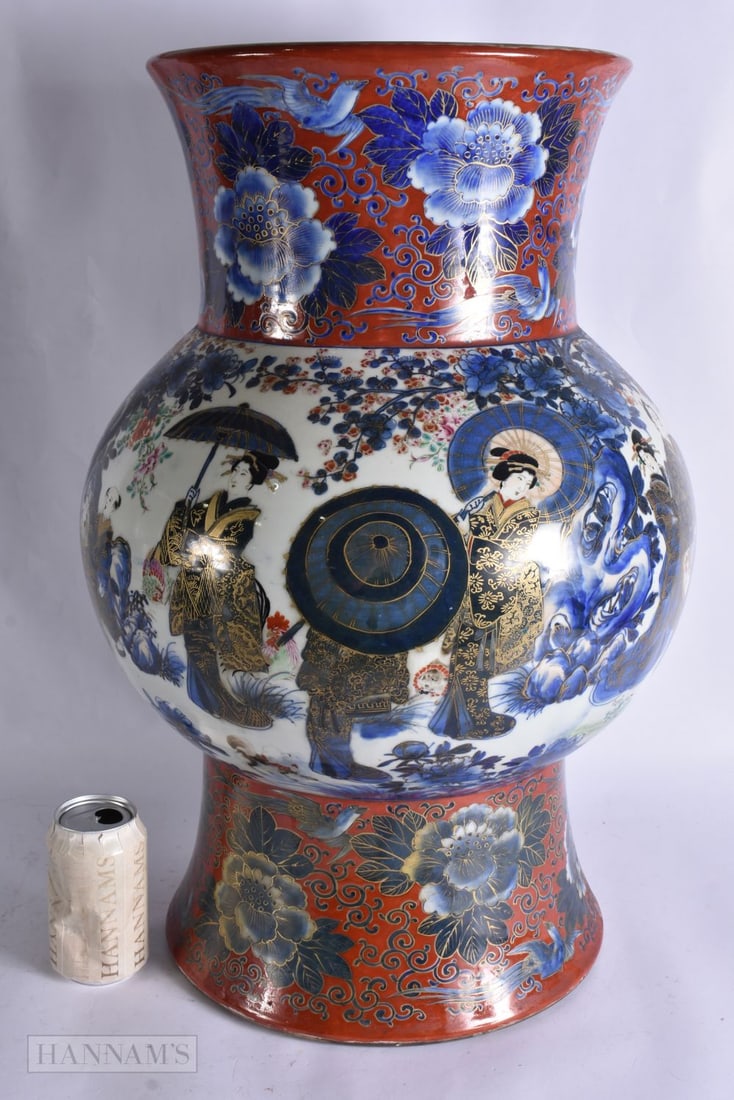 A VERY LARGE 19TH CENTURY JAPANESE MEIJI PERIOD COUNTRY HOUSE IMARI VASE painted with numerous figur: A VERY LARGE 19TH CENTURY JAPANESE MEIJI PERIOD COUNTRY HOUSE IMARI VASE painted with numerous figures upon a coral ground. 58 cm x 32 cm.
