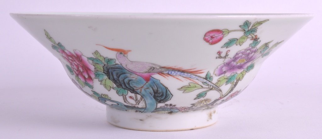 A CHINESE PORCELAIN OGEE SHAPED CIRCULAR BOWL 20th: A CHINESE PORCELAIN OGEE SHAPED CIRCULAR BOWL 20th Century, bearing Qianlong marks to base, decorated with a perched bird. 6.75ins diameter. £150-200