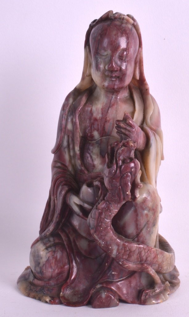 A GOOD 19TH CENTURY CHINESE CARVED SOAPSTONE FIGURE OF: A GOOD 19TH CENTURY CHINESE CARVED SOAPSTONE FIGURE OF LUOHAN well modelled beside a coiled dragon, depicted in flowing robes. 7.5ins high.